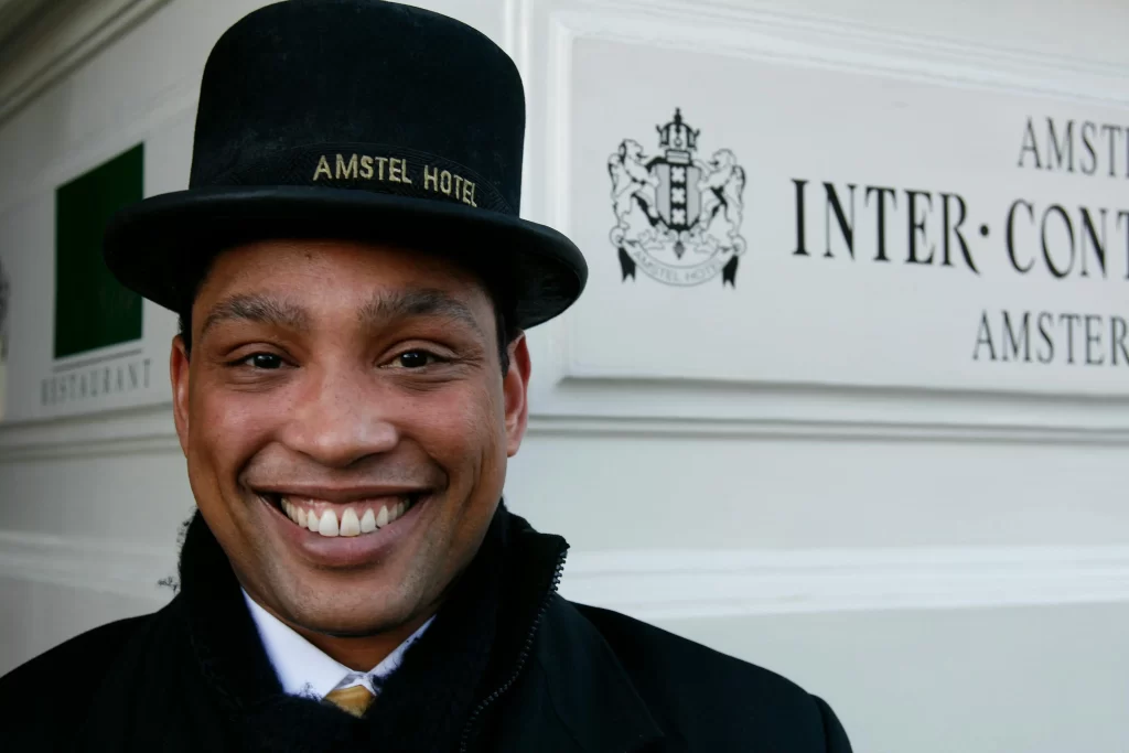 A professional server attentively assisting guests at an event, representing care, dedication, and the true spirit of service.