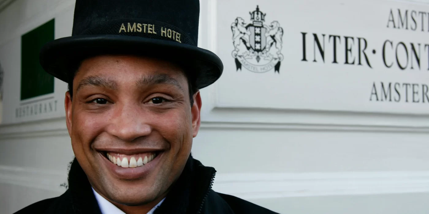 A professional server attentively assisting guests at an event, representing care, dedication, and the true spirit of service.