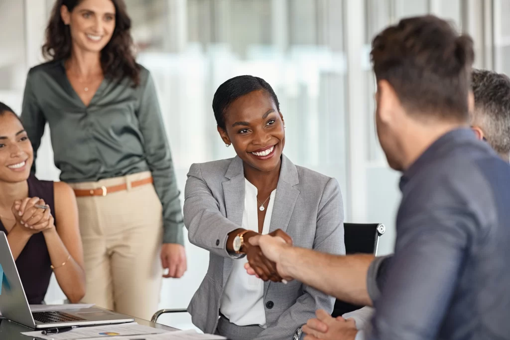 Event consultant meeting with clients while planning a special event, demonstrating professional communication and personalized service.